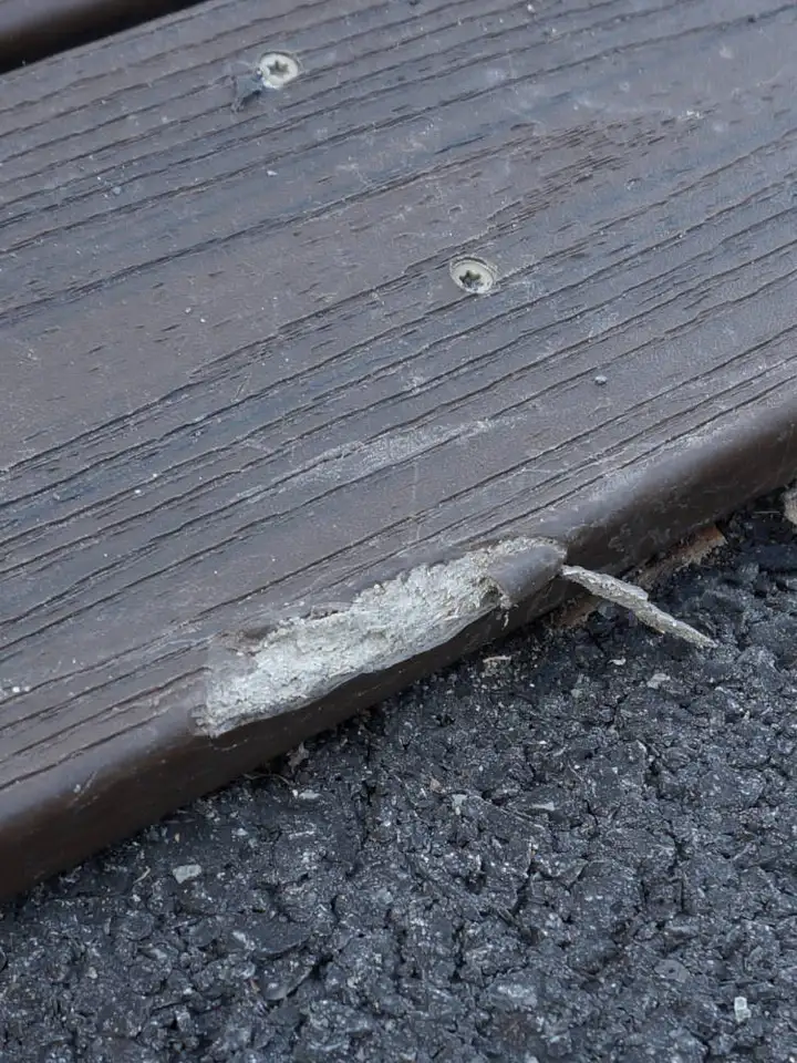 DK Lodge First decking board busted and chipped